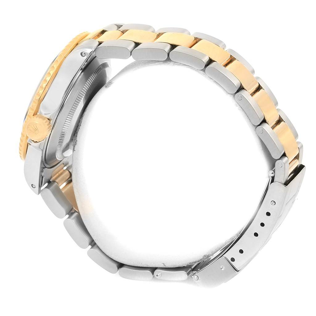 The image shows a side view of the Rolex Submariner 16613 Men's Steel and Gold (two tone) Grey Dial 16613 Men's Steel and Gold (two tone) Grey Dial, focusing on the crown, case, and two-tone bracelet.