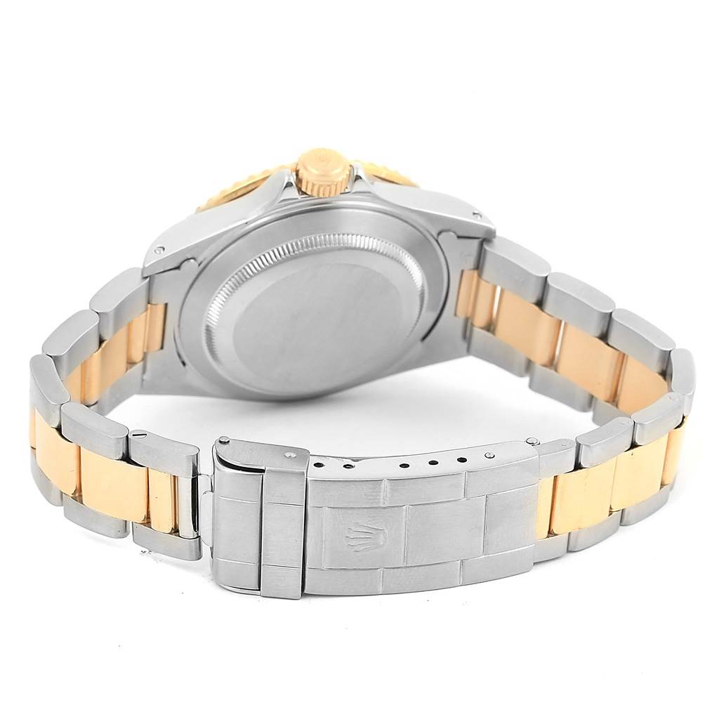 The image shows the back view of the Rolex Submariner 16613 Men's Steel and Gold (two tone) Grey Dial 16613 Men's Steel and Gold (two tone) Grey Dial watch, highlighting its case, bracelet, and clasp.