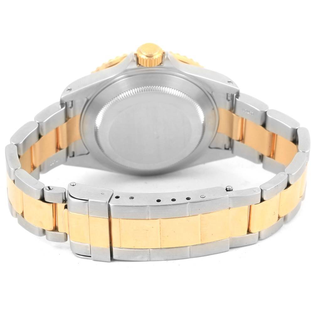 This image shows the back case and bracelet of a Rolex Submariner 16613 Men
s Steel and Gold (two tone) Black Dial 16613 Men
s Steel and Gold (two tone) Black Dial watch, viewed from the rear.