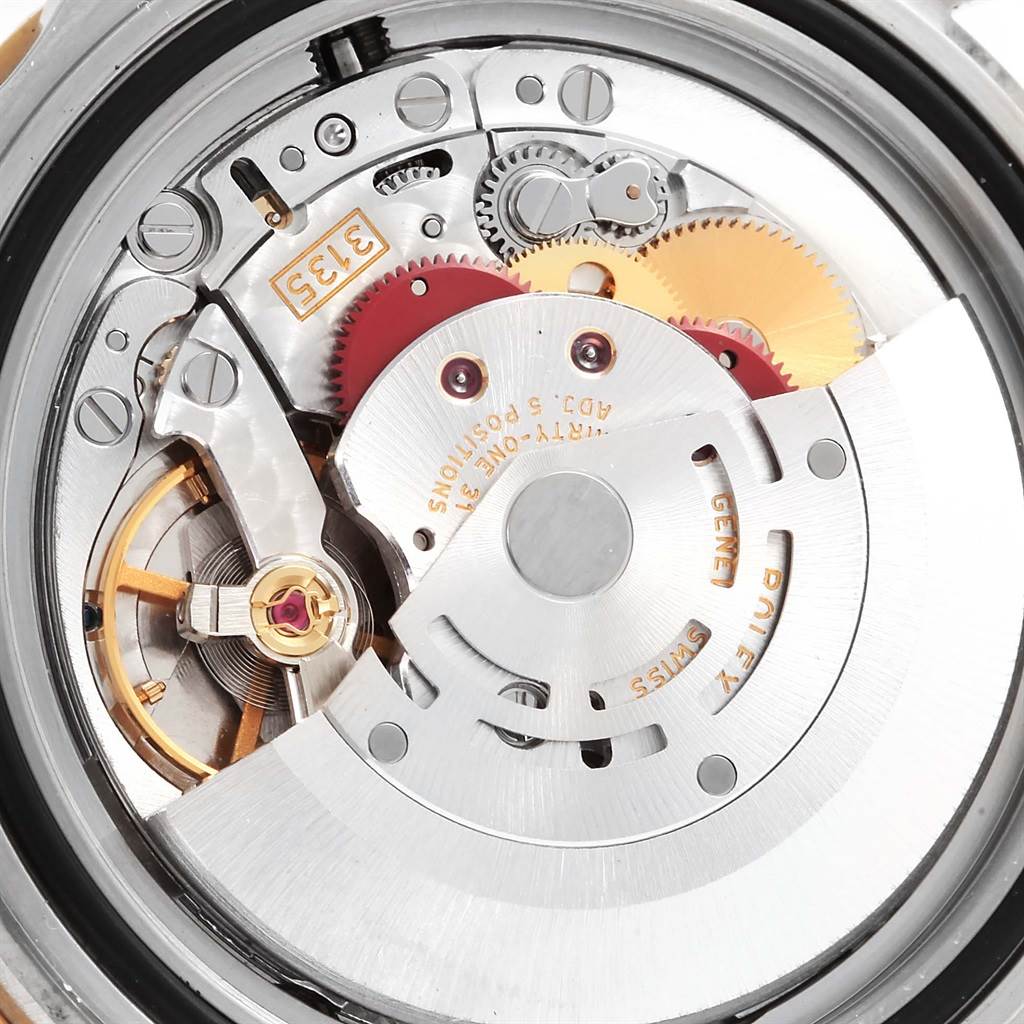 The image shows a close-up view of the movement mechanism of a Rolex Submariner 16613 Men's Steel and Gold (two tone) Blue Dial 16613 Men's Steel and Gold (two tone) Blue Dial watch.