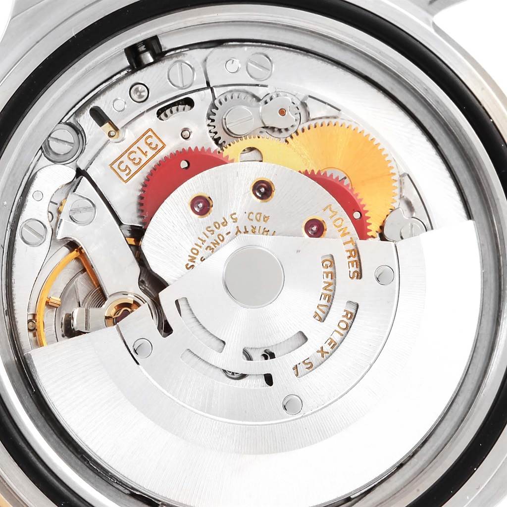 The image shows the inner mechanical movement of a Rolex Submariner 16613 Men's Steel and Gold (two tone) Champagne Dial 16613 Men's Steel and Gold (two tone) Champagne Dial watch from a close-up rear angle.