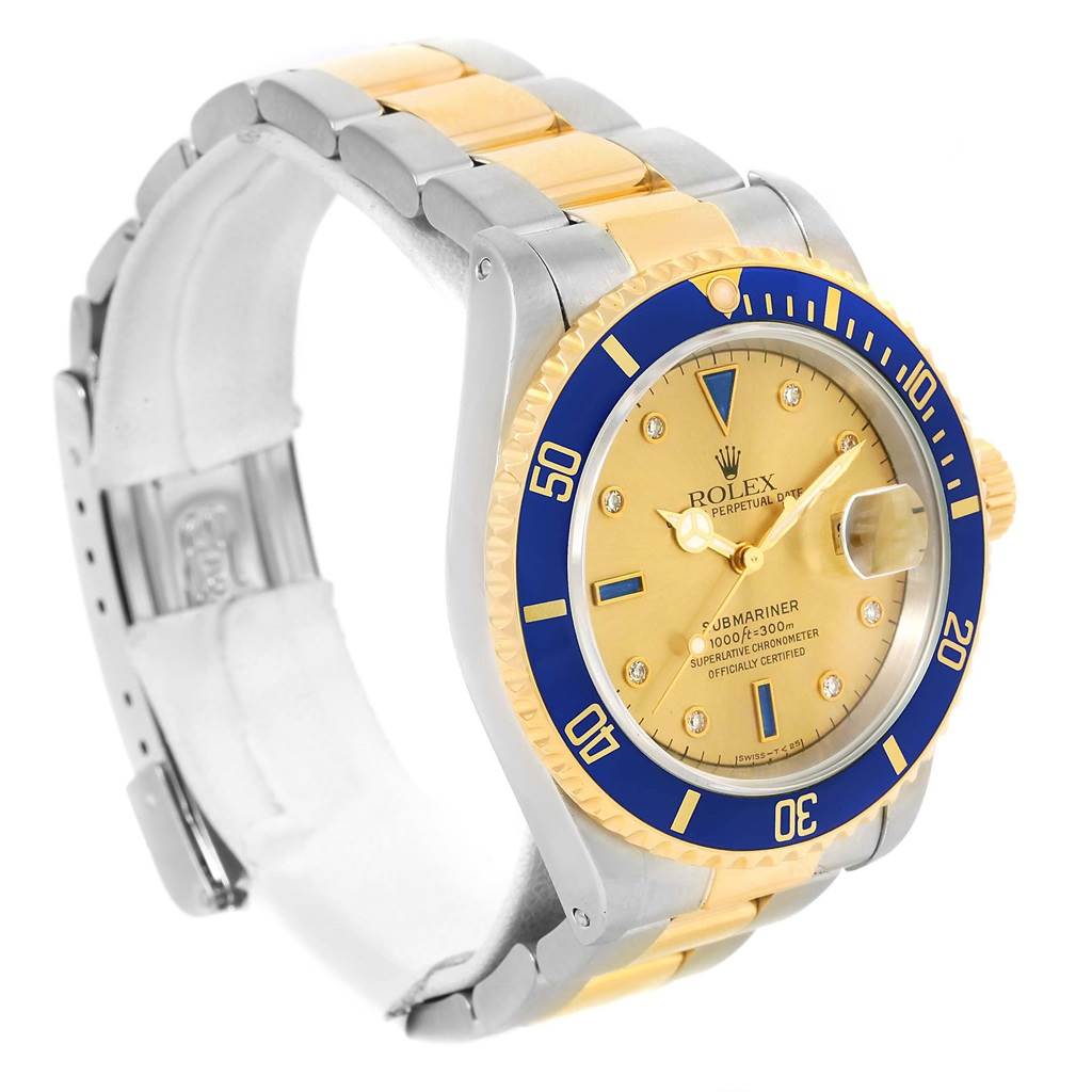This image shows a Rolex Submariner 16613 Men's Steel and Gold (two tone) Champagne Dial 16613 Men's Steel and Gold (two tone) Champagne Dial watch at a slight angle, highlighting the face, bezel, crown, and bracelet.