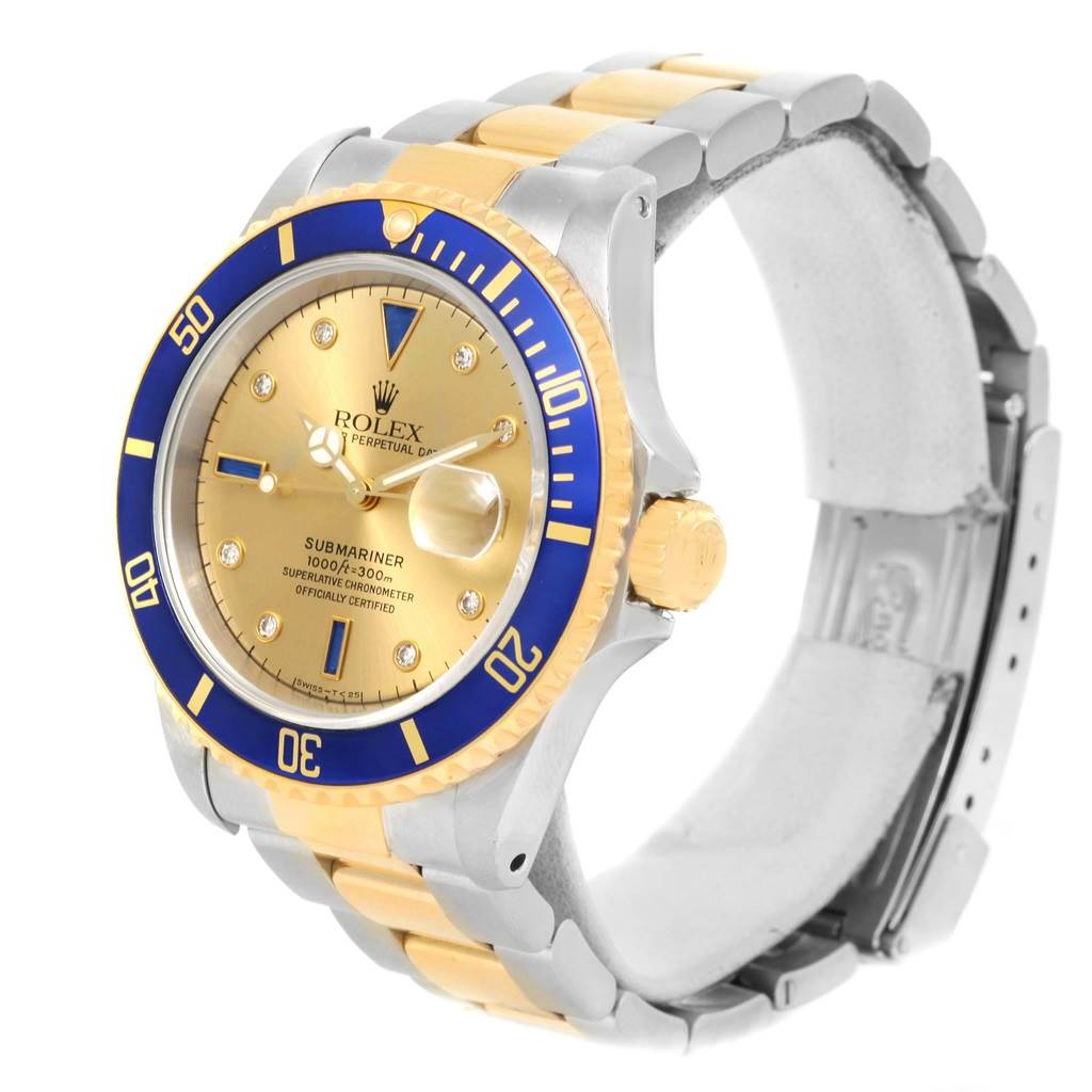 The image shows a Rolex Submariner 16613 Men's Steel and Gold (two tone) Champagne Dial 16613 Men's Steel and Gold (two tone) Champagne Dial watch angled to display the face, bezel, crown, and part of the bracelet.
