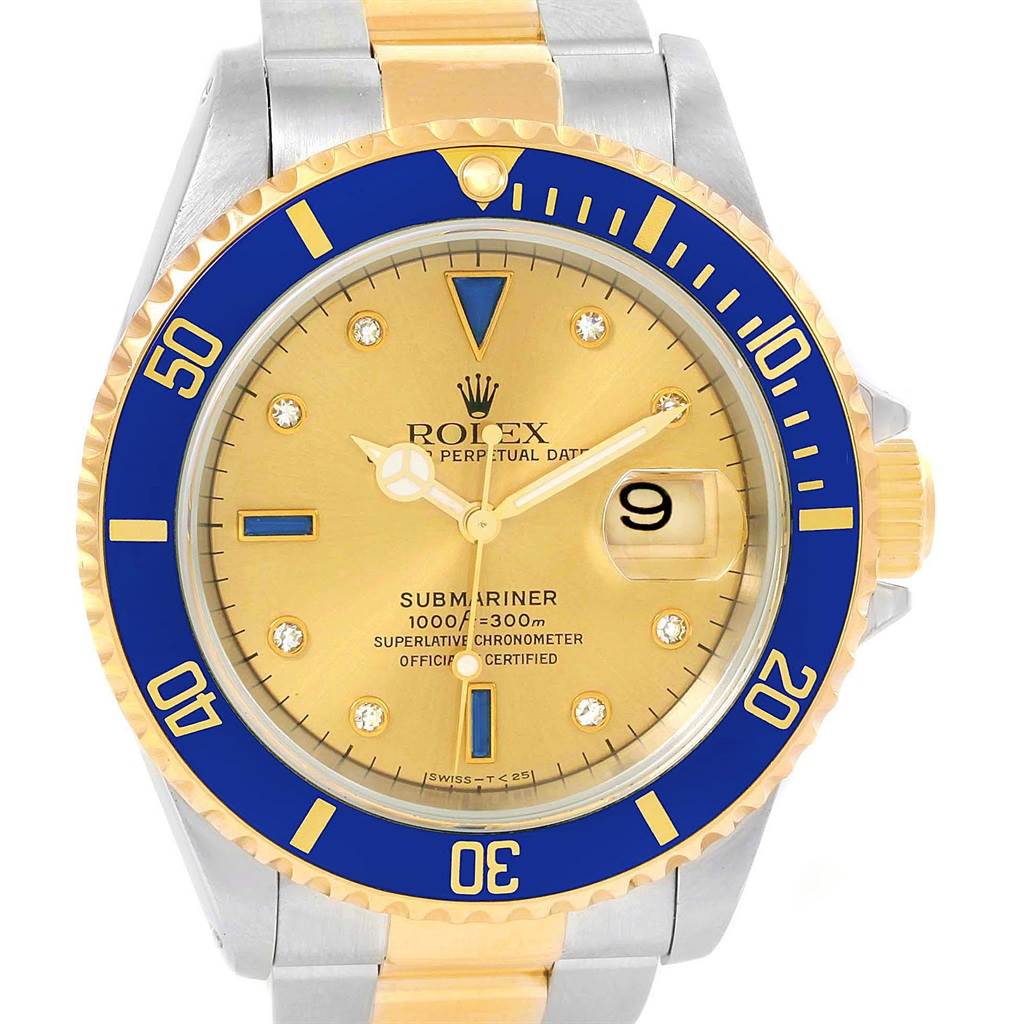 The image shows a Rolex Submariner 16613 Men's Steel and Gold (two tone) Champagne Dial 16613 Men's Steel and Gold (two tone) Champagne Dial watch from a front angle, highlighting the dial, bezel, and part of the bracelet.