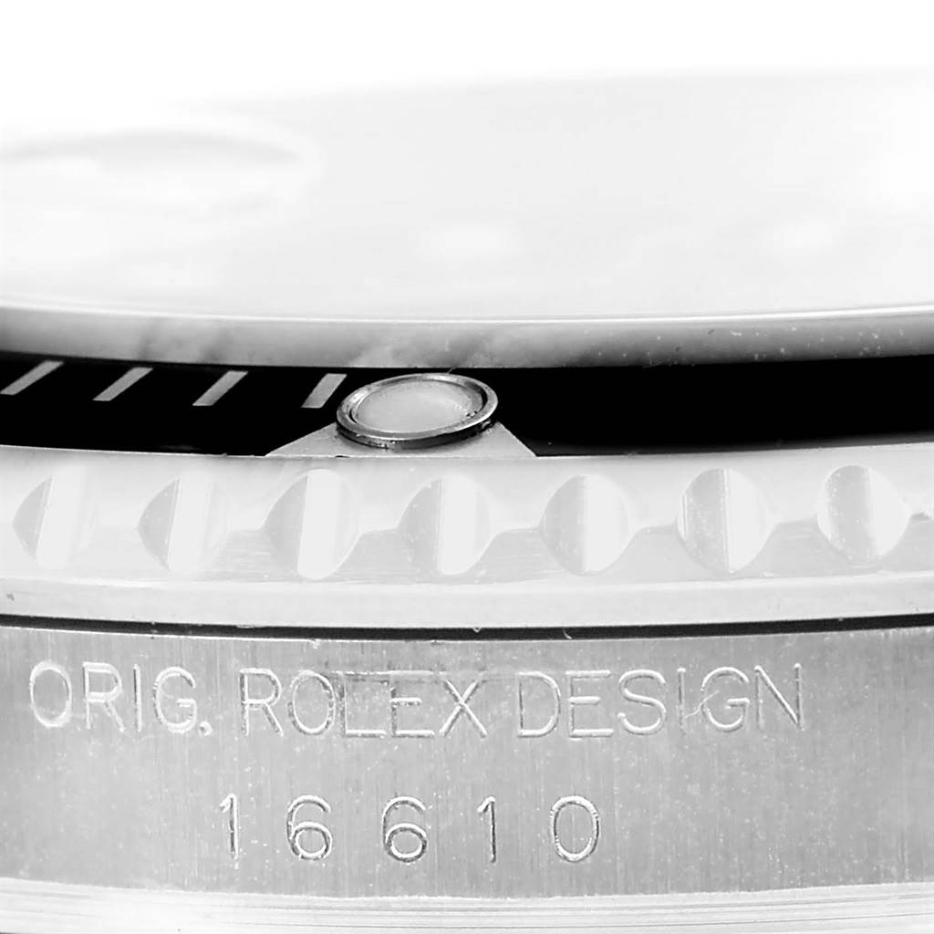 This close-up image shows the bezel and engraved side of a Rolex Submariner 16610 Men's Stainless Steel Black Dial 16610 Men's Stainless Steel Black Dial model, highlighting the design detail and model number 16610.