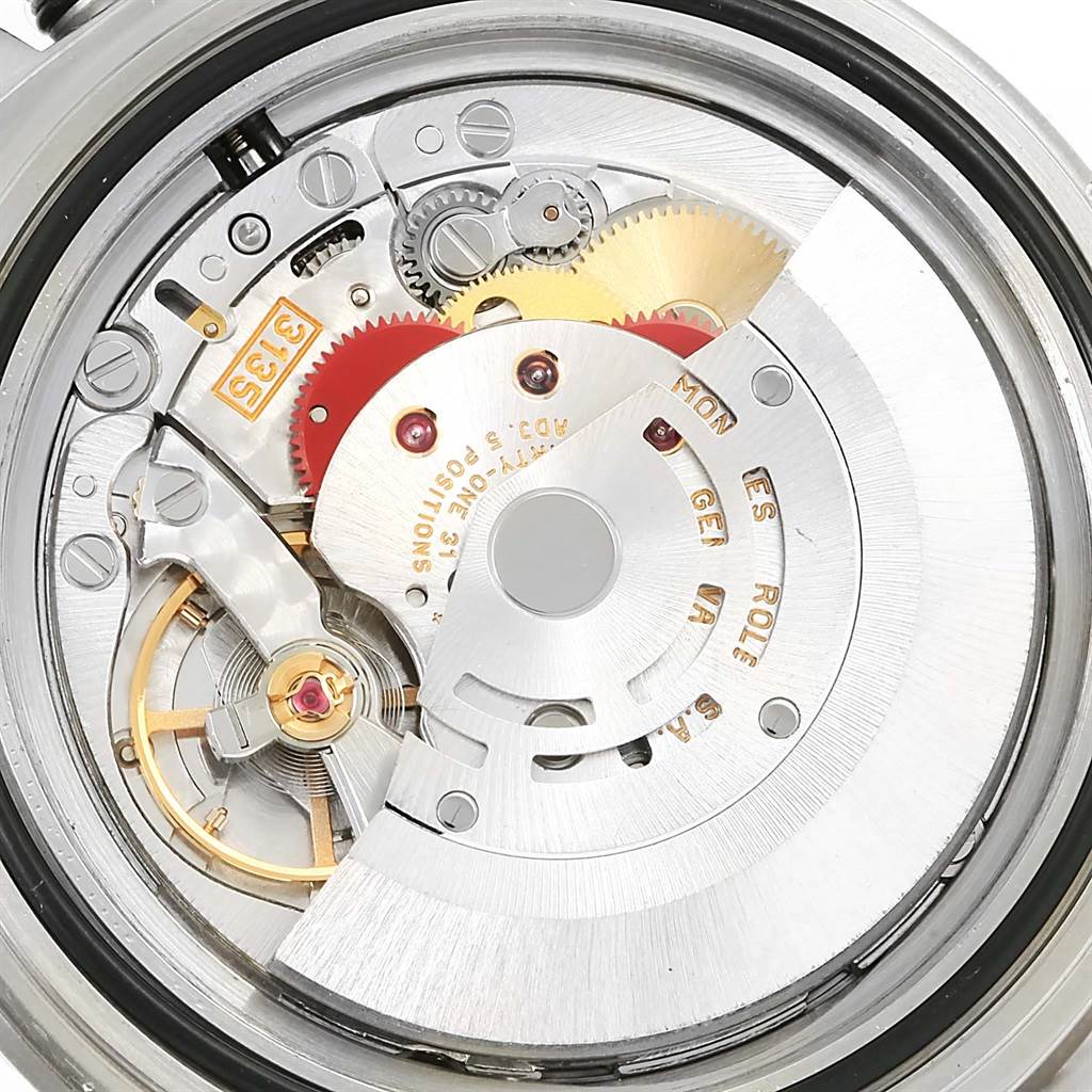 This is a close-up shot of the Rolex Submariner 16610 Men's Stainless Steel Black Dial 16610 Men's Stainless Steel Black Dial's movement, revealing its intricate mechanical components.