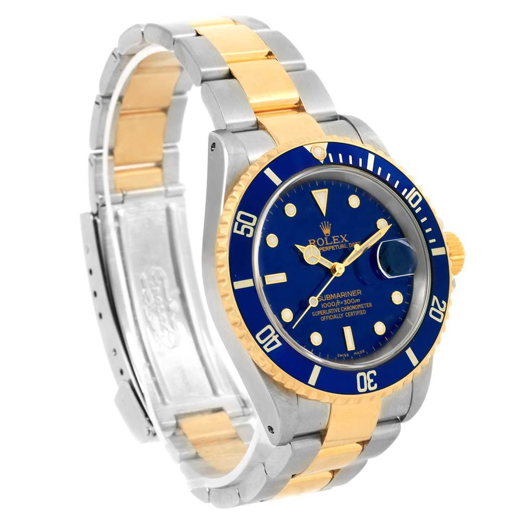 The Rolex Submariner 16613 Men's Steel and Gold (two tone) Blue Dial 16613 Men's Steel and Gold (two tone) Blue Dial watch is shown at a side angle, showcasing its blue dial, gold bezel, and two-tone gold and silver bracelet.