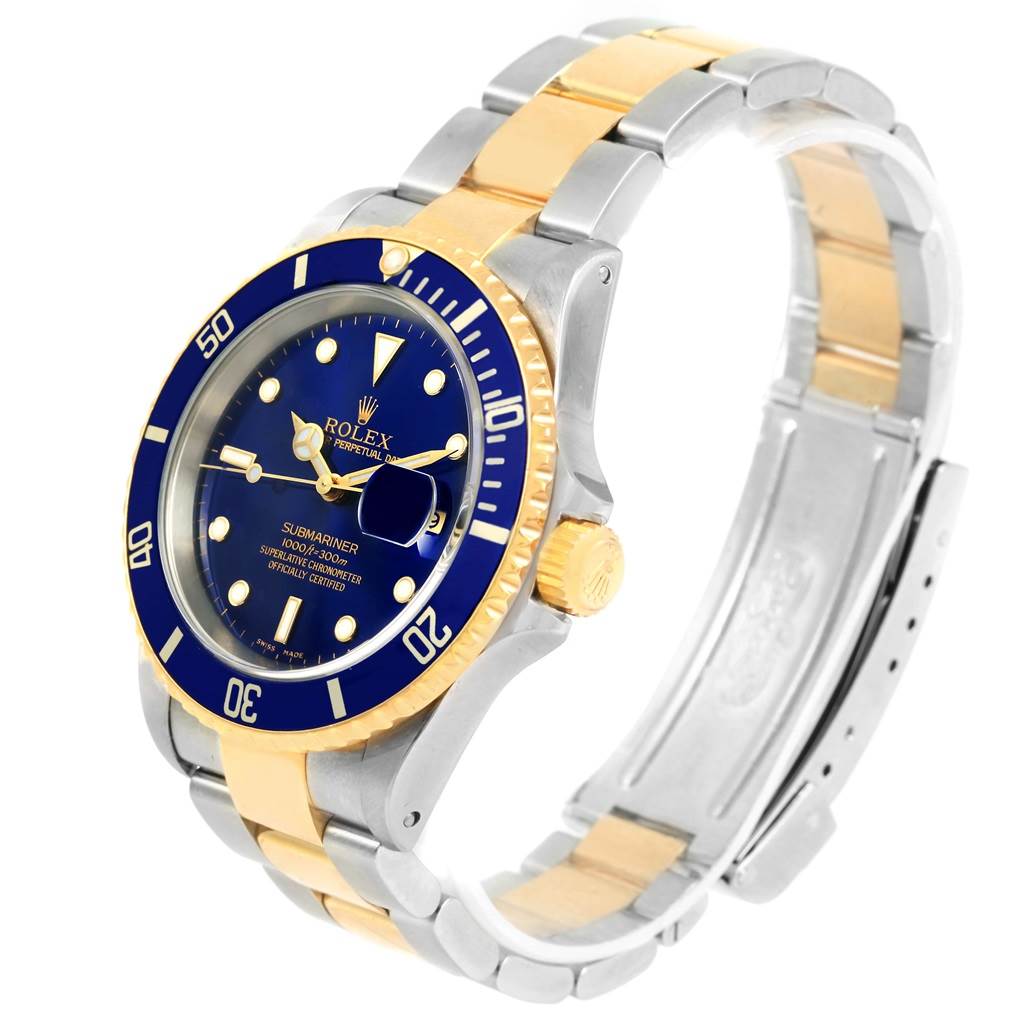 The image shows a side angle of the Rolex Submariner 16613 Men's Steel and Gold (two tone) Blue Dial 16613 Men's Steel and Gold (two tone) Blue Dial watch, highlighting the face, bezel, crown, and bracelet.