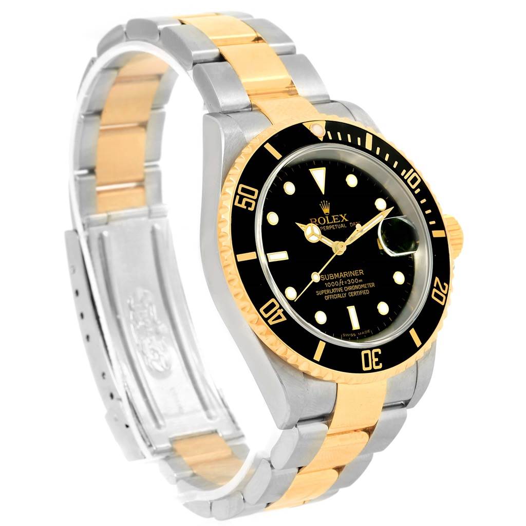 The image shows a Rolex Submariner 16613 Men's Steel and Gold (two tone) Black Dial 16613 Men's Steel and Gold (two tone) Black Dial watch at a three-quarter angle, highlighting its face, bezel, and two-tone bracelet.