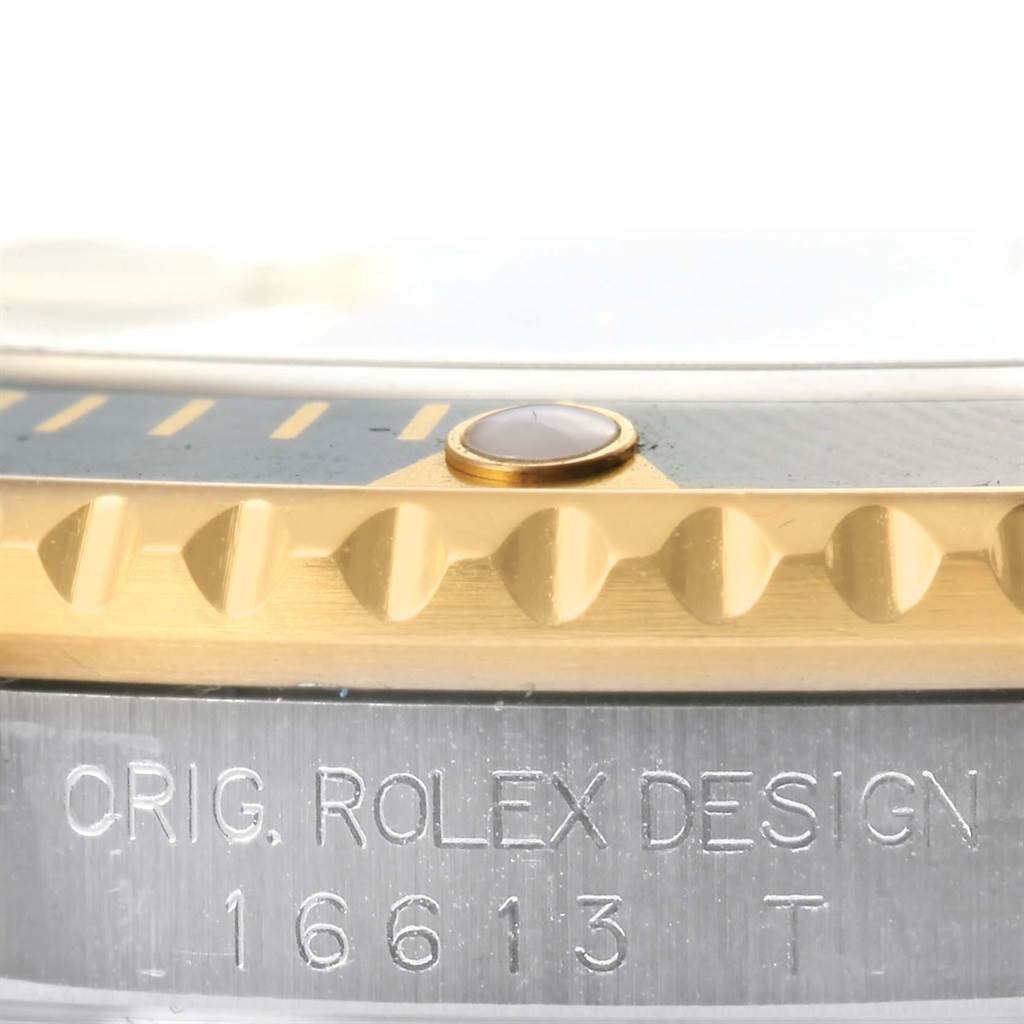 The image shows a close-up of the bezel and case side of a Rolex Submariner 16613 Men's Steel and Gold (two tone) Black Dial 16613 Men's Steel and Gold (two tone) Black Dial, with model number 16613 engraved.