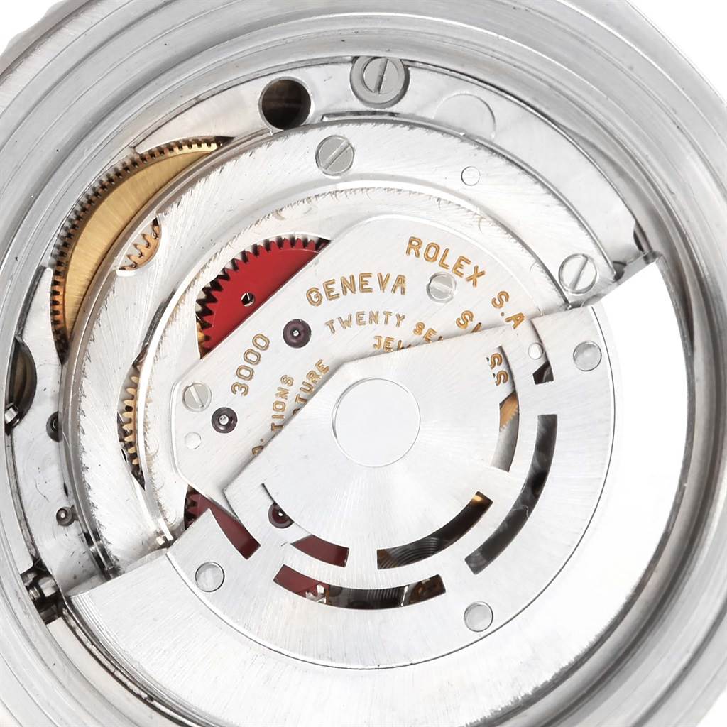 This image shows a close-up view of the internal mechanical movement of a Rolex Submariner 14060 Men's Stainless Steel Black Dial 14060 Men's Stainless Steel Black Dial watch.