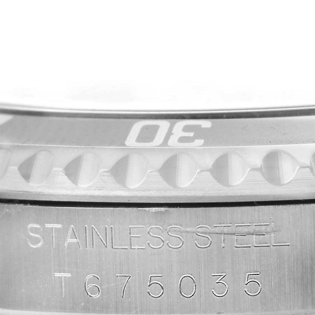 This image shows a close-up of the bezel and case side of a Rolex Submariner 14060 Men's Stainless Steel Black Dial 14060 Men's Stainless Steel Black Dial watch.