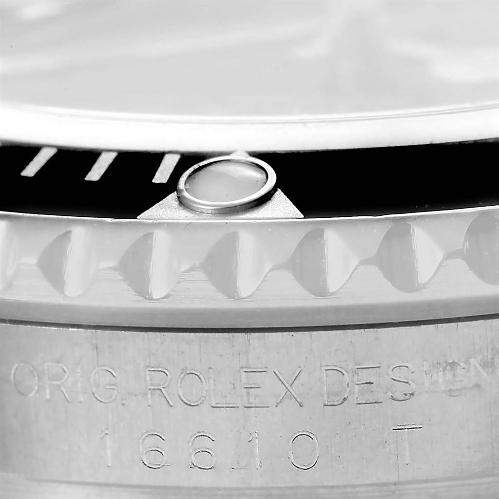 This image shows a close-up of the bezel and part of the case with the engraving of the Rolex Submariner 16610 Men
s Stainless Steel Black Dial 16610 Men
s Stainless Steel Black Dial model 16610T.