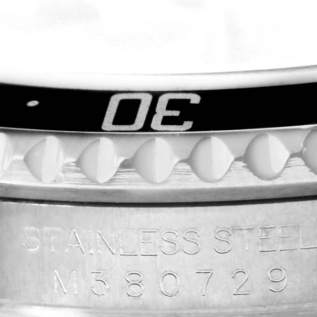 The image shows a close-up of the bezel teeth and side engraving of a Rolex Submariner 16610 Men
s Stainless Steel Black Dial 16610 Men
s Stainless Steel Black Dial watch.