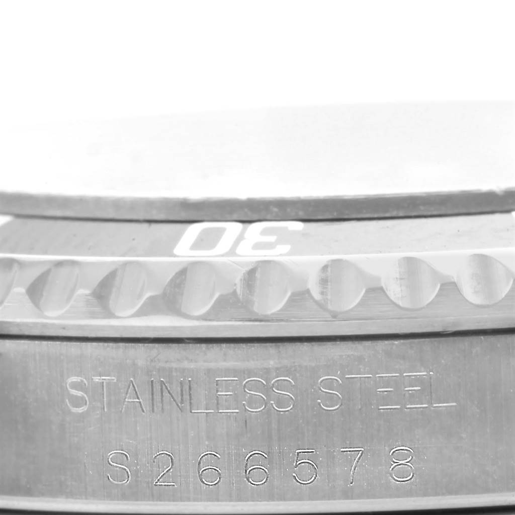 This close-up image shows the bezel with "30" marking and a part of the case of a Rolex Submariner 14060 Men's Stainless Steel Black Dial 14060 Men's Stainless Steel Black Dial watch in stainless steel.