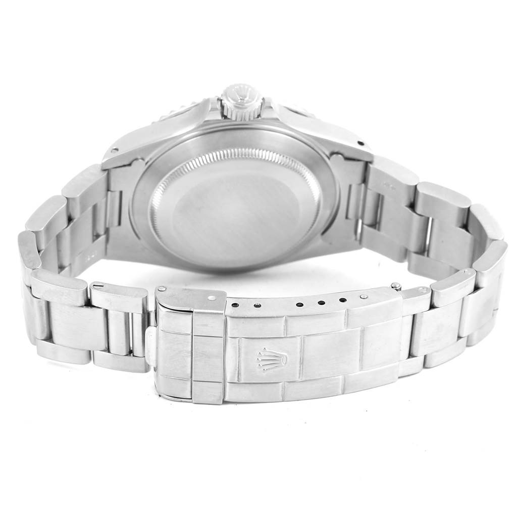 This image shows the back case and bracelet of a Rolex Submariner 14060 Men's Stainless Steel Black Dial 14060 Men's Stainless Steel Black Dial watch.