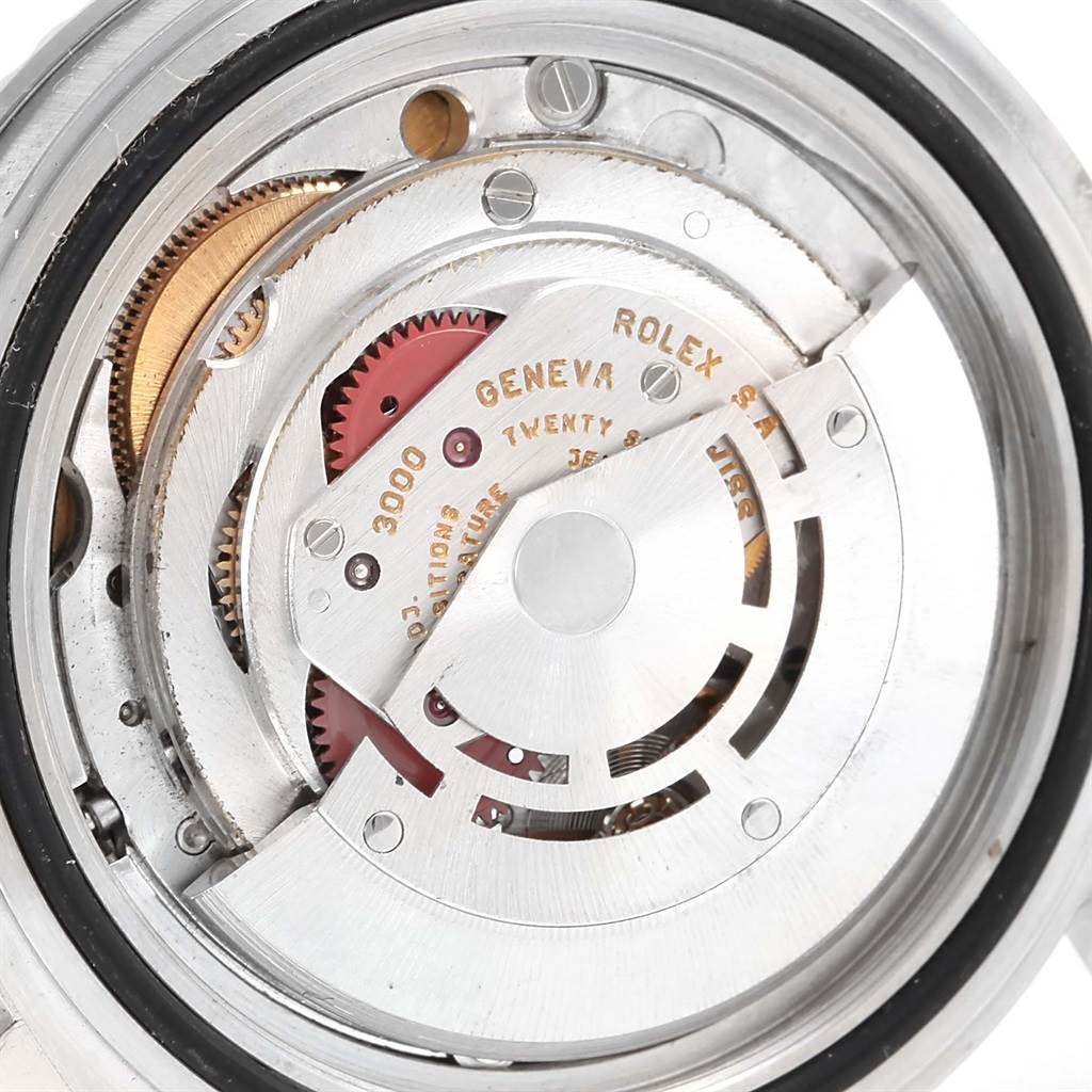 The image shows a close-up view of the internal movement mechanism of a Rolex Submariner 14060 Men's Stainless Steel Black Dial 14060 Men's Stainless Steel Black Dial watch.