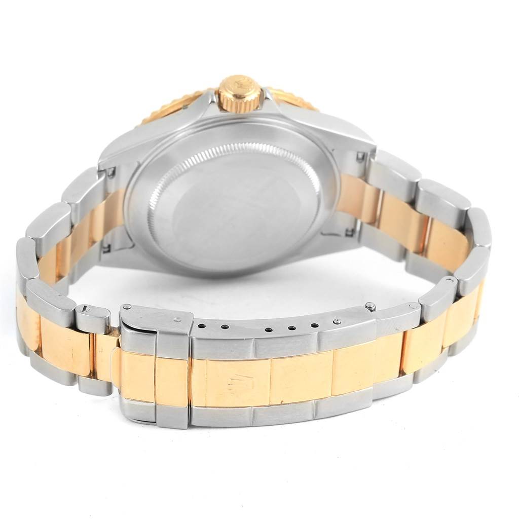 The image shows the back view of a Rolex Submariner 16613 Men's Steel and Gold (two tone) Blue Dial 16613 Men's Steel and Gold (two tone) Blue Dial watch, focusing on its case back and bracelet.