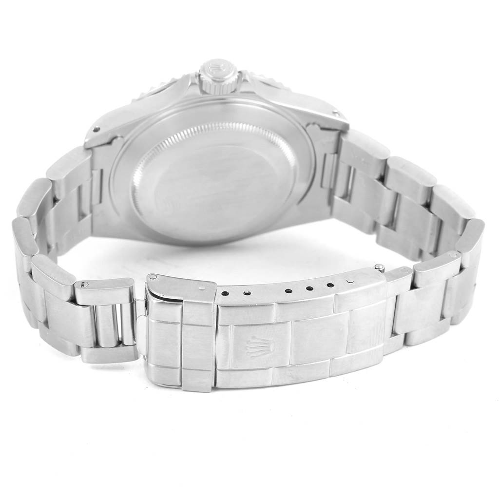 The image shows the back of a Rolex Submariner 14060 Men's Stainless Steel Black Dial 14060 Men's Stainless Steel Black Dial watch, highlighting the case back, crown, and metal bracelet.