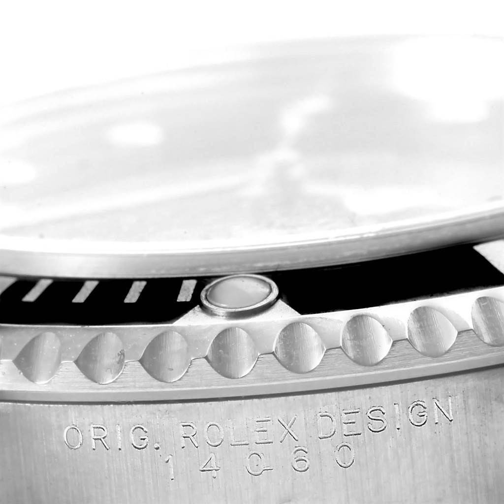 The image shows a close-up view of the bezel, crystal, and engraved case side of a Rolex Submariner 14060 Men's Stainless Steel Black Dial 14060 Men's Stainless Steel Black Dial watch.