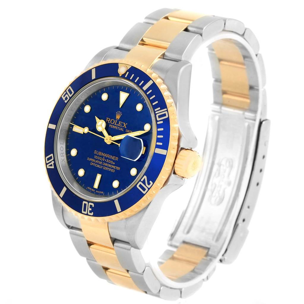 This image shows a Rolex Submariner 16613 Men's Steel and Gold (two tone) Blue Dial 16613 Men's Steel and Gold (two tone) Blue Dial watch at a three-quarter angle, highlighting its blue dial, rotating bezel, and two-tone bracelet.