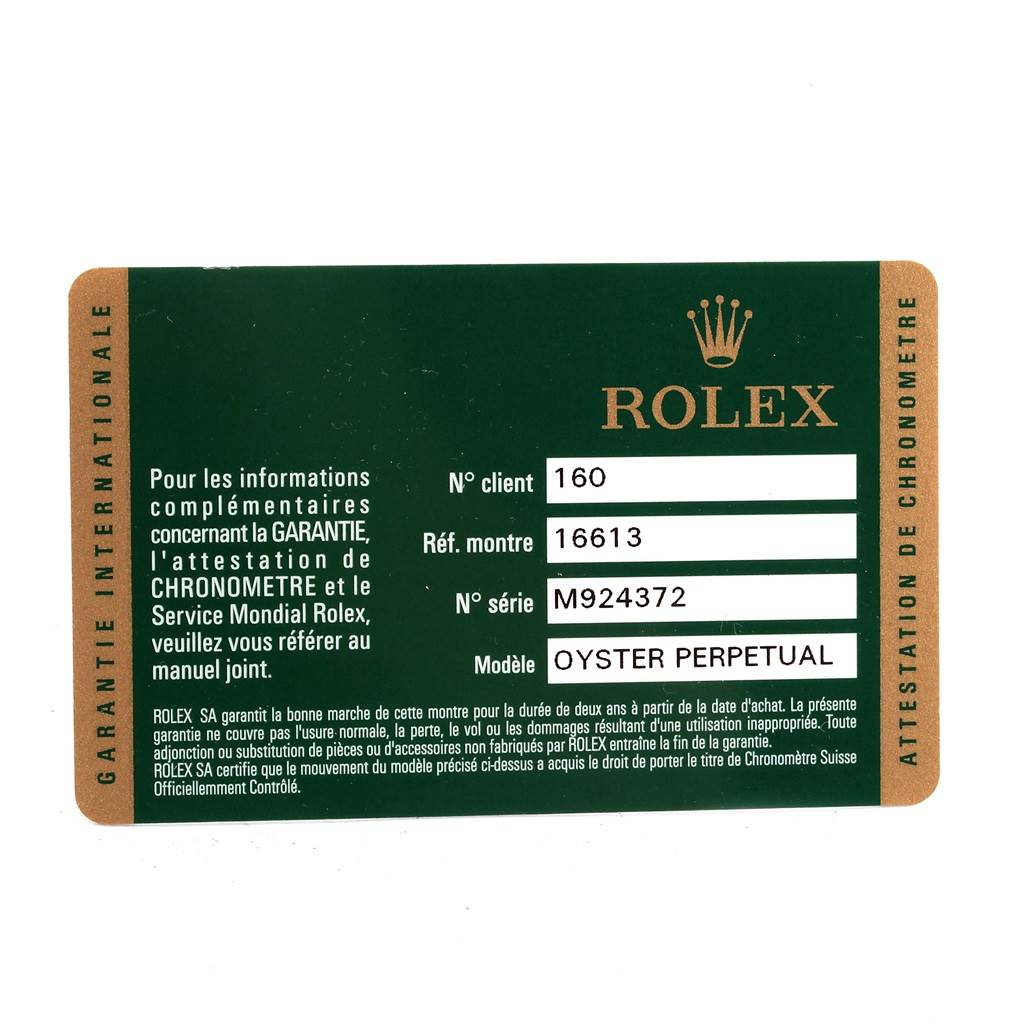 This image shows the warranty card for a Rolex Submariner 16613 Men's Steel and Gold (two tone) Blue Dial 16613 Men's Steel and Gold (two tone) Blue Dial, providing information like model, reference, and serial numbers.