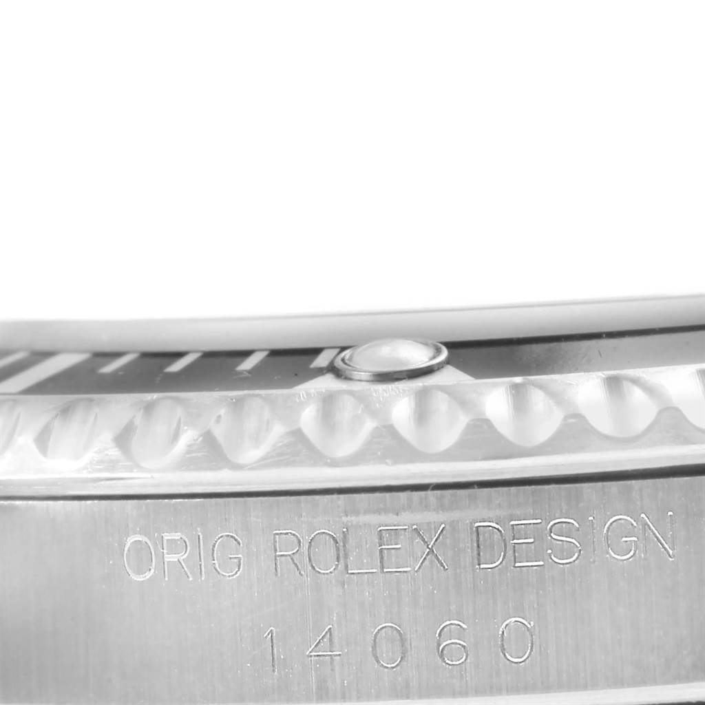 This is a close-up angle showing the side engraving and the bezel of the Rolex Submariner 14060 Men's Stainless Steel Black Dial 14060 Men's Stainless Steel Black Dial.
