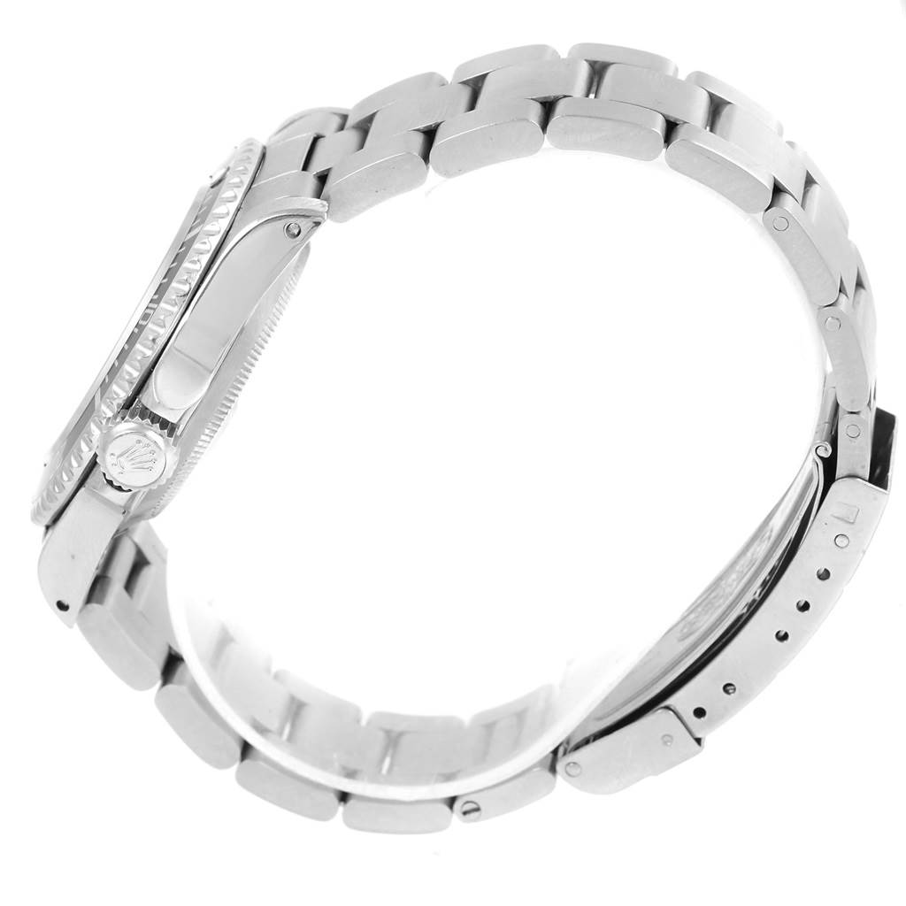 The image shows a side view of the Rolex Submariner 14060 Men's Stainless Steel Black Dial 14060 Men's Stainless Steel Black Dial, highlighting the case, bezel, crown, and bracelet.