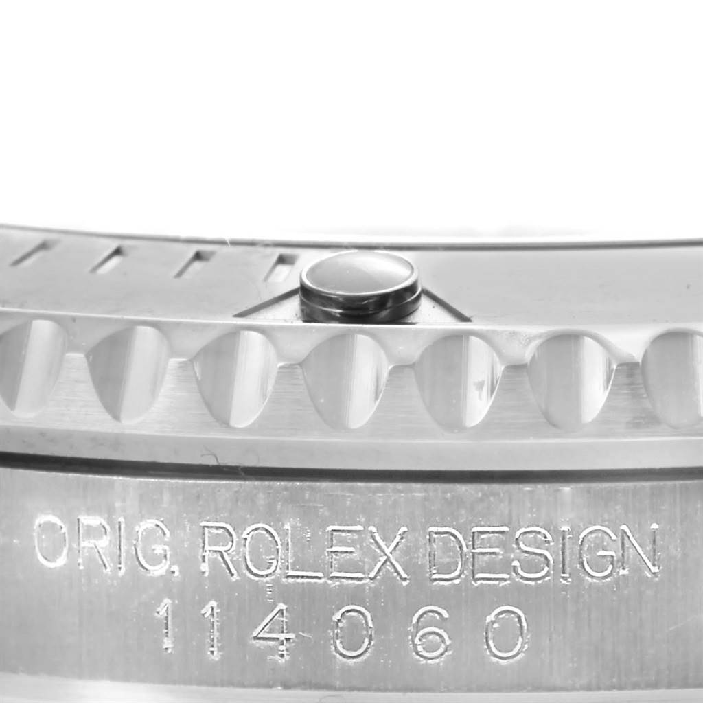 This close-up image of a Rolex Submariner 114060 Men's Stainless Steel Black Dial 114060 Men's Stainless Steel Black Dial watch shows the edge of the bezel and the model engraving on the side.