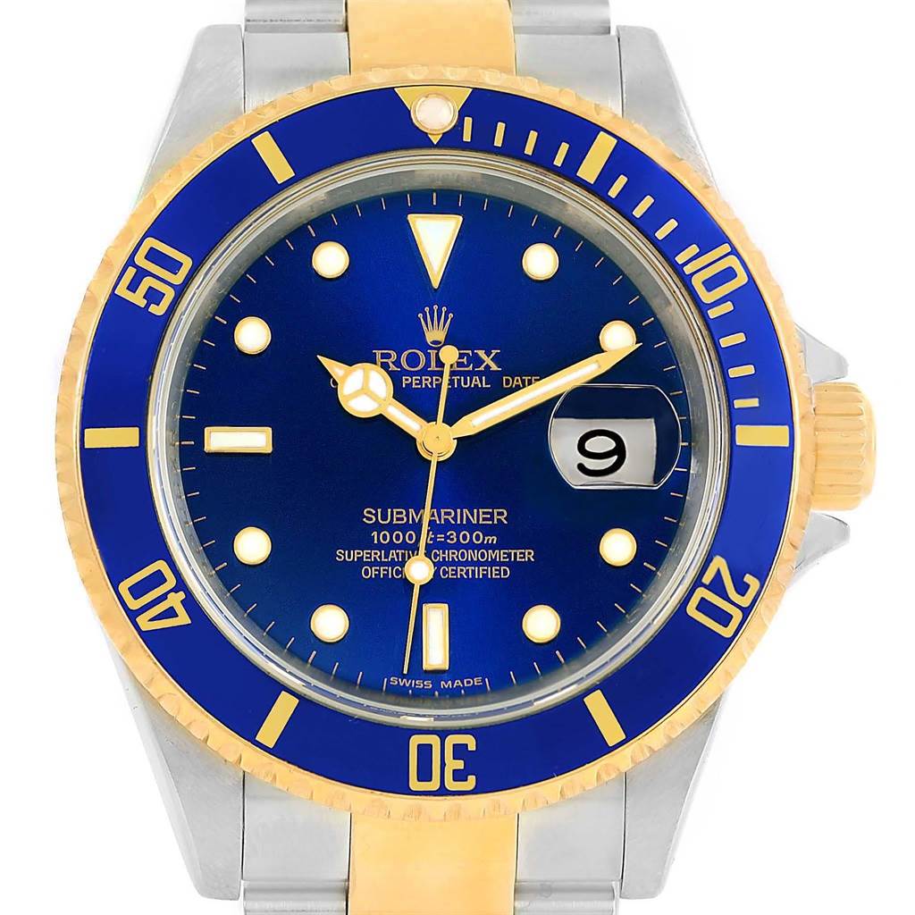 The image shows a front view of a Rolex Submariner 16613 Men
s Steel and Gold (two tone) Blue Dial 16613 Men
s Steel and Gold (two tone) Blue Dial watch, featuring its blue and gold bezel, dial, and the date window at 3 o
clock.