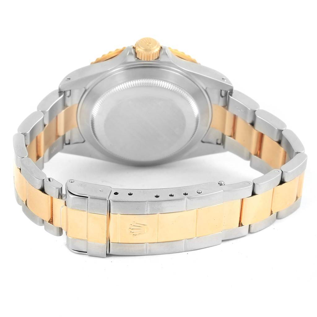 The image shows the case back and bracelet clasp of a Rolex Submariner 16613 Men's Steel and Gold (two tone) Blue Dial 16613 Men's Steel and Gold (two tone) Blue Dial watch from a rear angle.