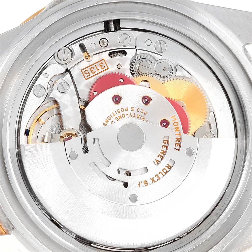 This image shows a close-up view of the movement mechanism inside the Rolex Submariner 16613 Men's Steel and Gold (two tone) Blue Dial 16613 Men's Steel and Gold (two tone) Blue Dial watch.