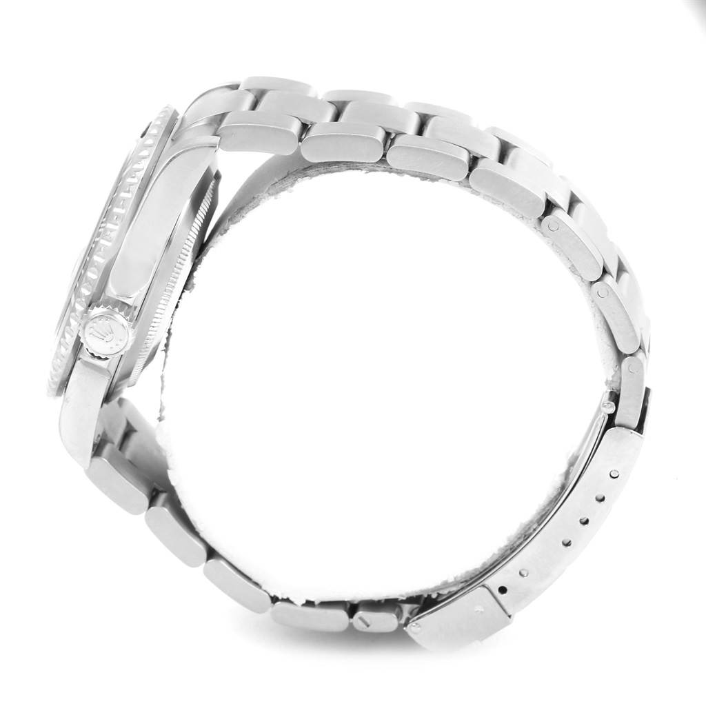 The image shows the side view of a Rolex Submariner 16610 Men's Stainless Steel Black Dial 16610 Men's Stainless Steel Black Dial watch, focusing on its bracelet, clasp, and crown.