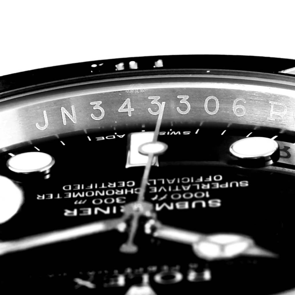 This close-up image shows the dial and part of the rehaut with serial engravings of a Rolex Submariner 116610 Men's Stainless Steel Black Dial 116610 Men's Stainless Steel Black Dial watch.