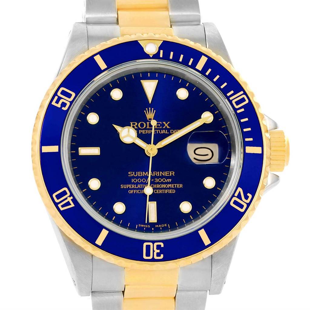 This image shows a close-up, front view of the Rolex Submariner 16803 Men's Steel and Gold (two tone) Blue Dial 16803 Men's Steel and Gold (two tone) Blue Dial watch highlighting its blue and gold bezel, dial, and part of the bracelet.