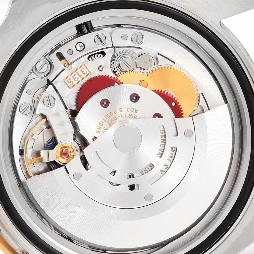 This image shows the internal mechanical movement parts of a Rolex Submariner 116613 Men's Steel and Gold (two tone) Blue Dial 116613 Men's Steel and Gold (two tone) Blue Dial watch from the back.