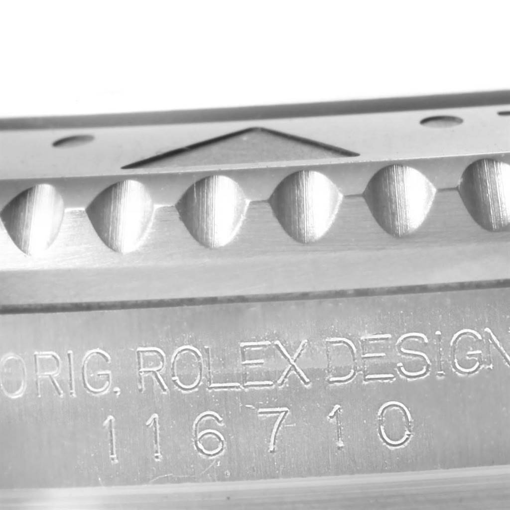 The image shows a close-up of a Rolex Submariner 116710 Men's Stainless Steel Black Dial 116710 Men's Stainless Steel Black Dial model, highlighting the side casing with the engraving "ORIG. ROLEX DESIGN 116710."