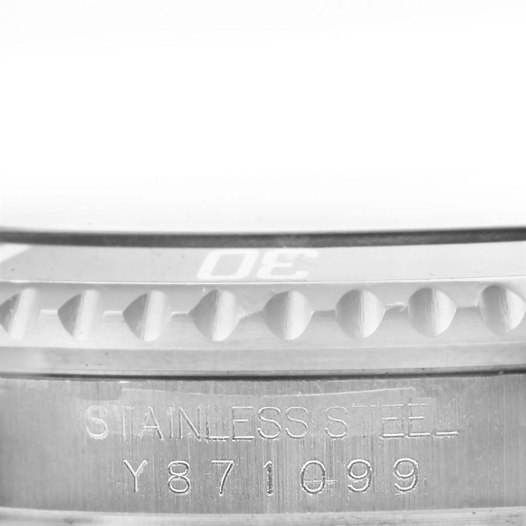 This image shows a close-up of the engraved stainless steel body and partially visible bezel of the Rolex Submariner 16610 Men's Stainless Steel Black Dial 16610 Men's Stainless Steel Black Dial watch.