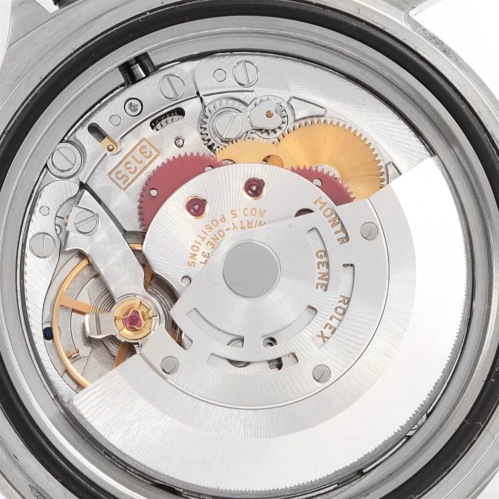 This is a close-up view of the internal mechanical movement of a Rolex Submariner 16610 Men's Stainless Steel Black Dial 16610 Men's Stainless Steel Black Dial watch.