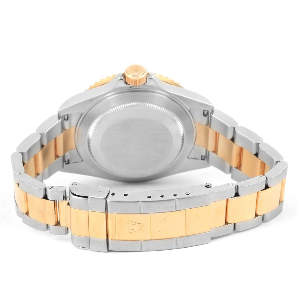 This image shows the back case and bracelet of a Rolex Submariner 16613 Steel and Gold (two tone) Blue Dial 16613 Steel and Gold (two tone) Blue Dial watch, focusing on the two-tone metal links and clasp.