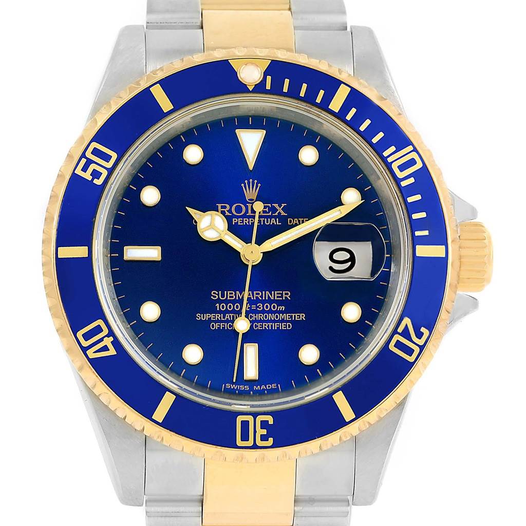 The image shows a front view of a Rolex Submariner 16613 Steel and Gold (two tone) Blue Dial 16613 Steel and Gold (two tone) Blue Dial with a blue dial, date window, and a gold and silver bracelet.