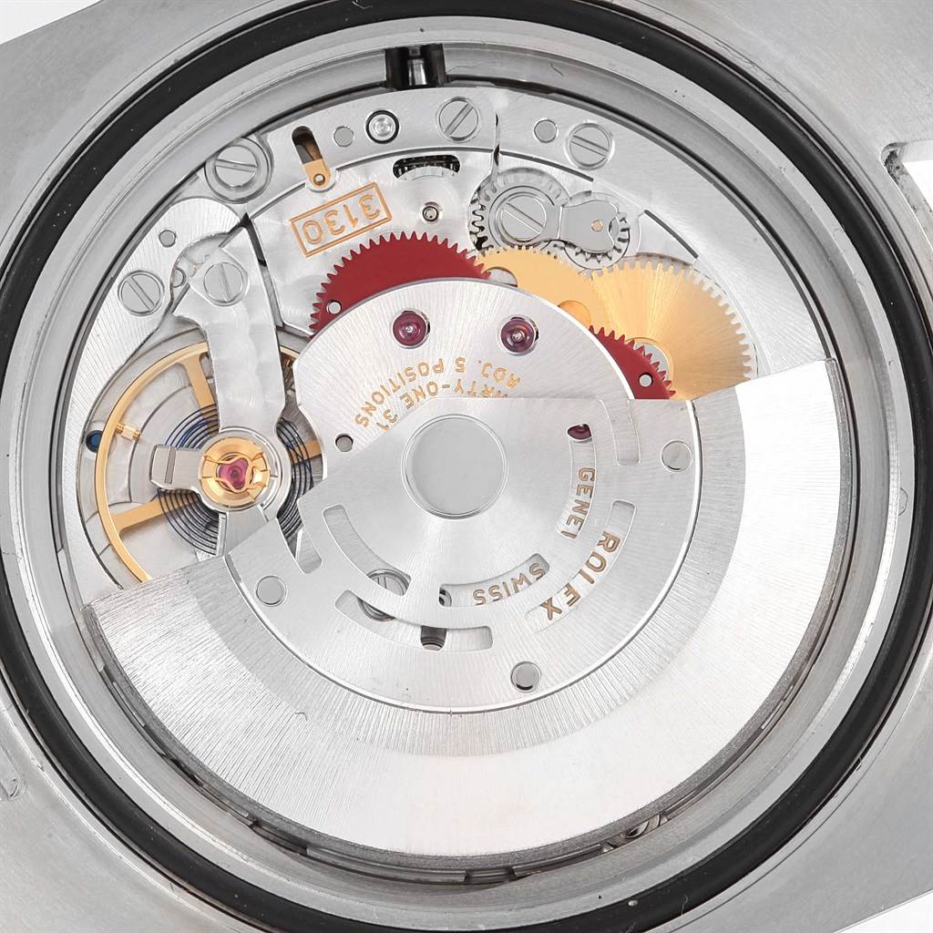 Close-up of the internal movement of a Rolex Submariner 114060 Men's Stainless Steel Black Dial 114060 Men's Stainless Steel Black Dial, showing gears, jewels, and the rotor.