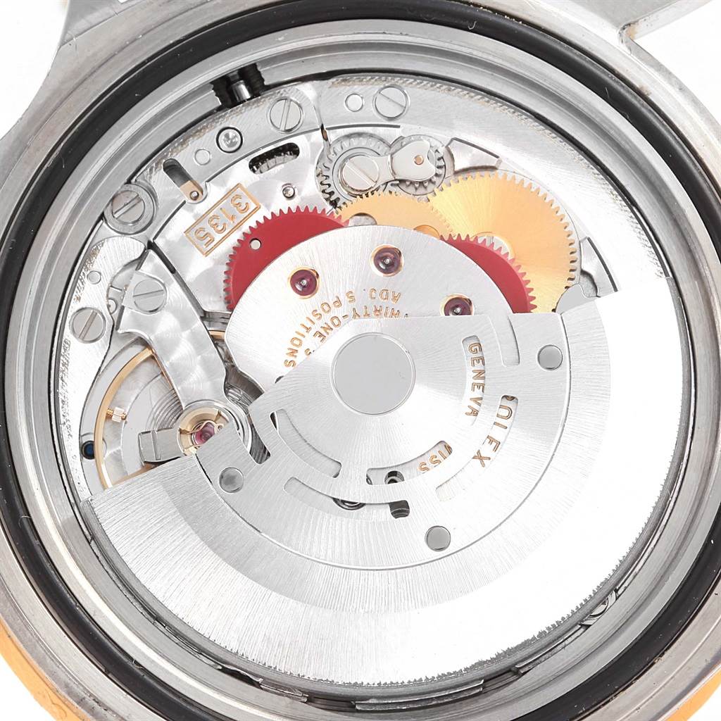The image shows the internal movement components of the Rolex Submariner 16613 Men
s Steel and Gold (two tone) Black Dial 16613 Men
s Steel and Gold (two tone) Black Dial watch at a close-up angle.