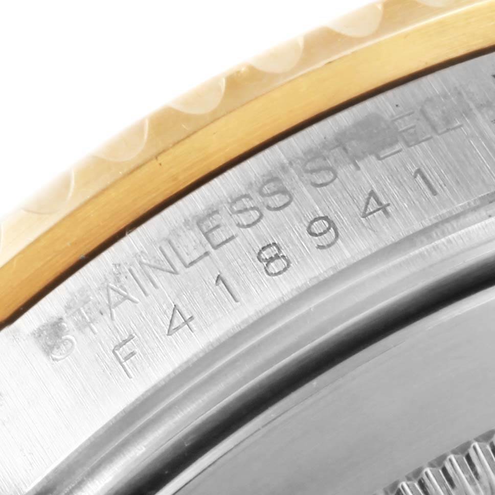 The image shows a close-up of the serial number engraving on the side of a Rolex Submariner 16613 Men
s Steel and Gold (two tone) Black Dial 16613 Men
s Steel and Gold (two tone) Black Dial watch.