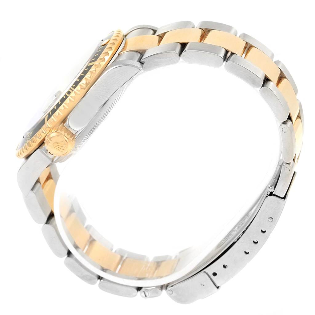 The image shows a side view of the Rolex Submariner 16613 Men
s Steel and Gold (two tone) Black Dial 16613 Men
s Steel and Gold (two tone) Black Dial watch, highlighting the two-tone bracelet, crown, and part of the bezel.