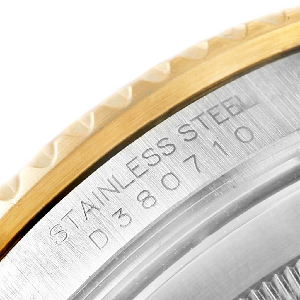 The image shows the edge of the bezel and the engraved serial number of a Rolex Submariner 16613 Men's Steel and Gold (two tone) Blue Dial 16613 Men's Steel and Gold (two tone) Blue Dial watch.