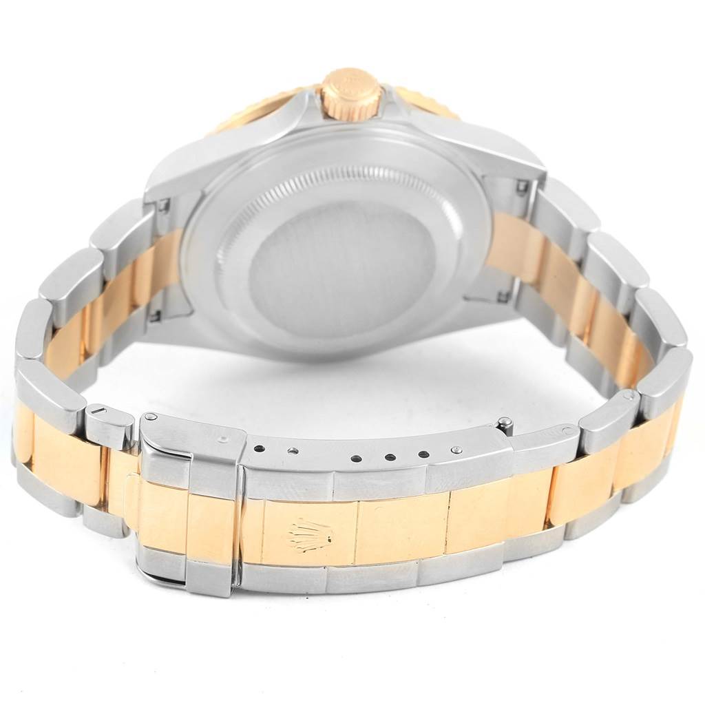 The image shows the back view and clasp of a Rolex Submariner 16613 Men's Steel and Gold (two tone) Blue Dial 16613 Men's Steel and Gold (two tone) Blue Dial watch, highlighting the two-tone bracelet.