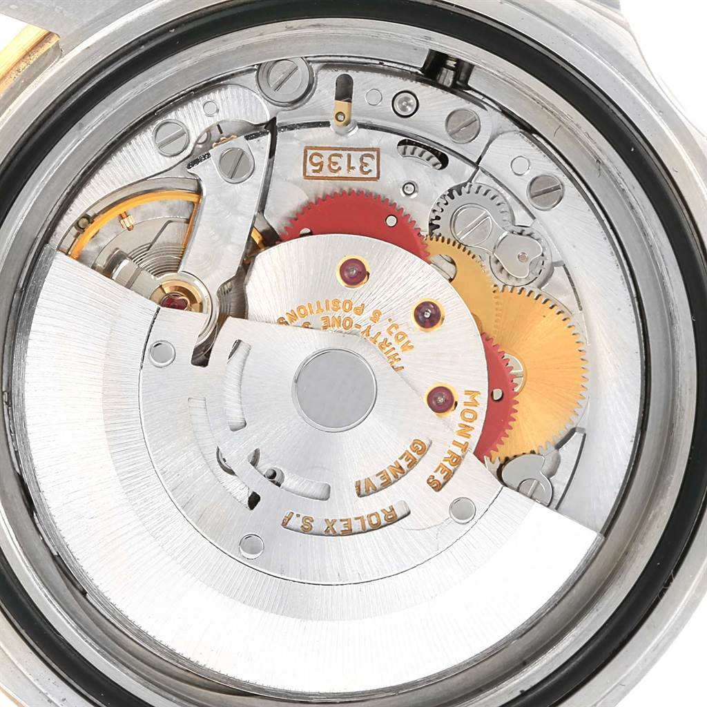 This image shows a close-up view of the inner mechanical components of a Rolex Submariner 16613 Men
s Steel and Gold (two tone) Champagne Dial 16613 Men
s Steel and Gold (two tone) Champagne Dial watch movement.