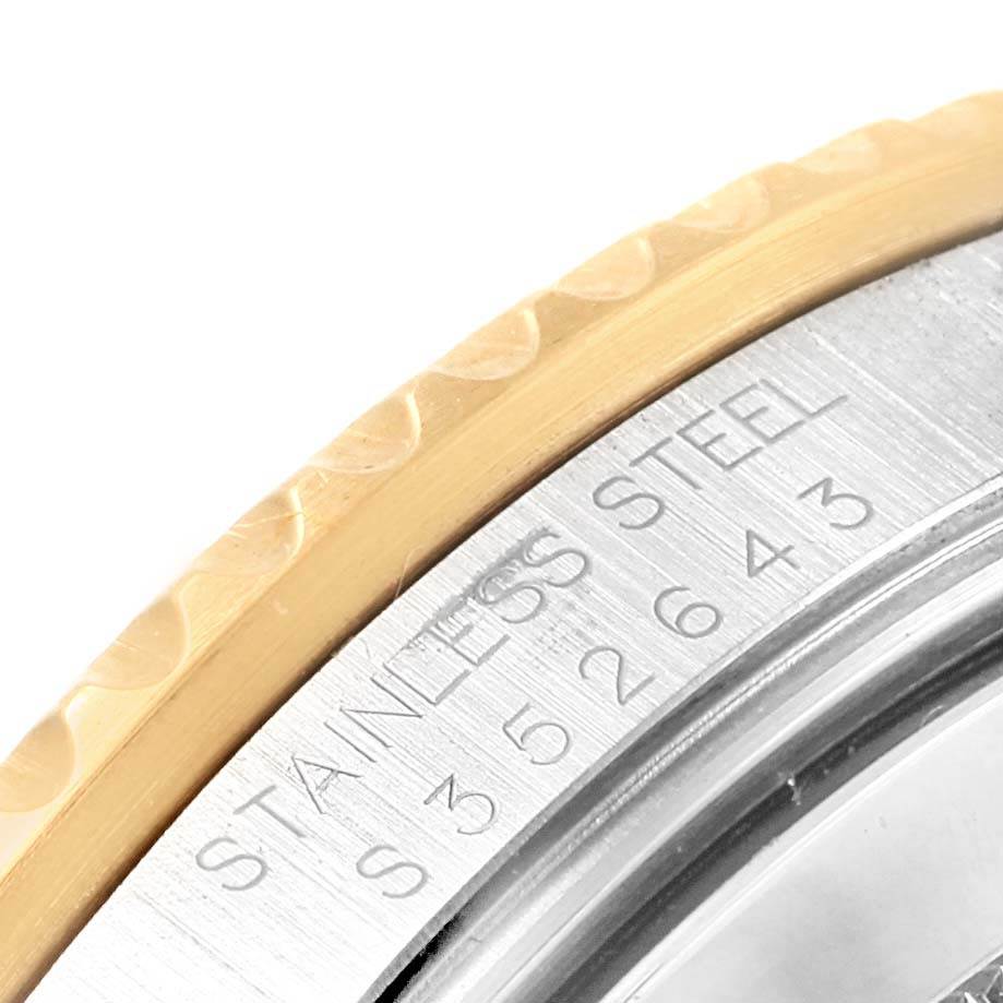 The image shows a close-up of the stainless steel case and gold bezel edge of a Rolex Submariner 16613 Men
s Steel and Gold (two tone) Champagne Dial 16613 Men
s Steel and Gold (two tone) Champagne Dial watch.