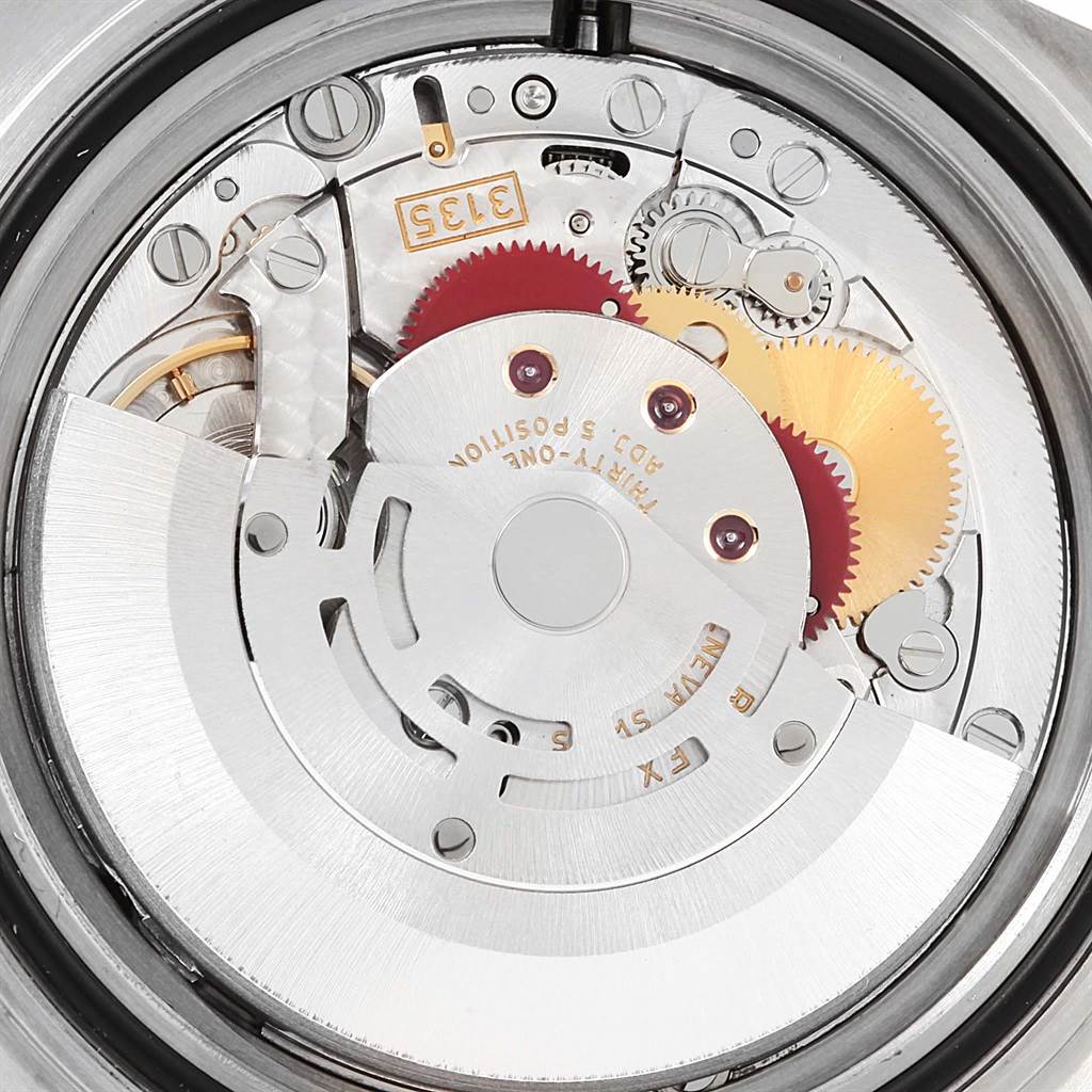 The image shows the internal mechanism of a Rolex Submariner 16613 Men's Steel and Gold (two tone) Blue Dial 16613 Men's Steel and Gold (two tone) Blue Dial watch, highlighting gears and components from the back view.